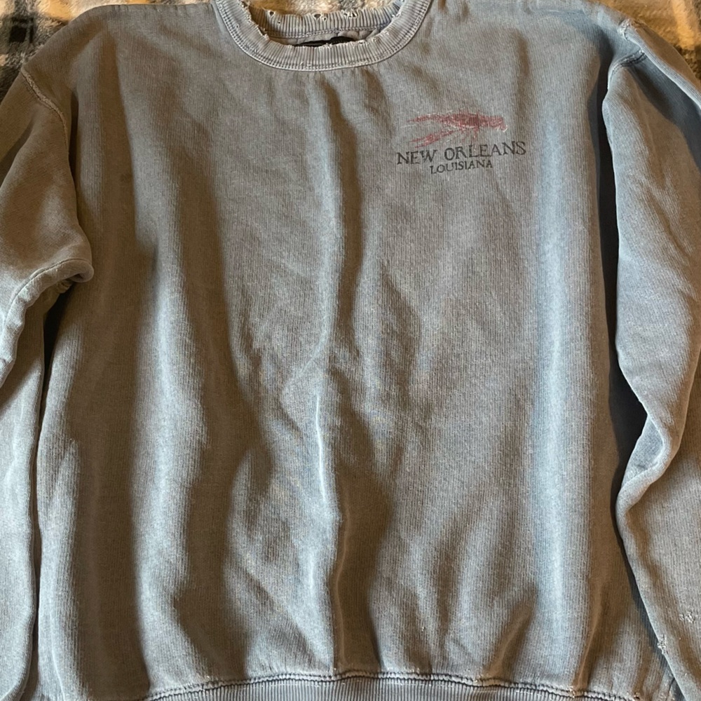 frayed, blue crew neck